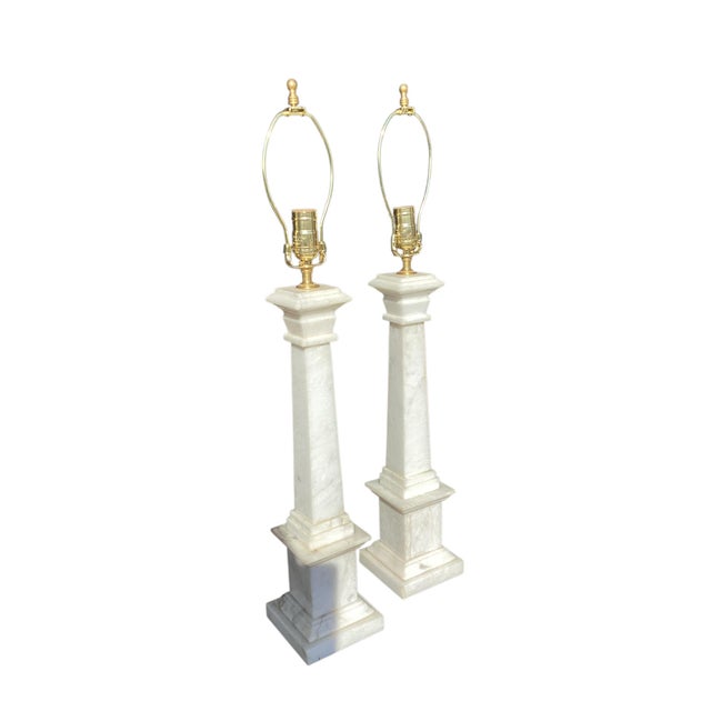 Pair of Italian Alabaster Column Lamps. Square column sits atop a plinth base. Lamps have been rewired, with new sockets....