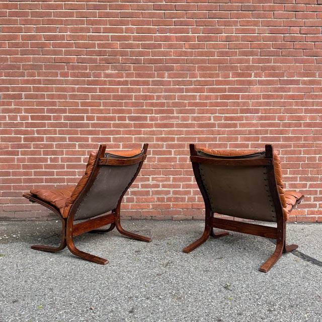 Pair of 1970s “Siesta” lounge chairs designed by Ingmar Relling for Westnofa, Norway. Rosewood bentwood frames paired with...