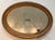 This elegant, large hand painted gold oval frame with a 1 inch beveled mirror is a classic example of a French style...