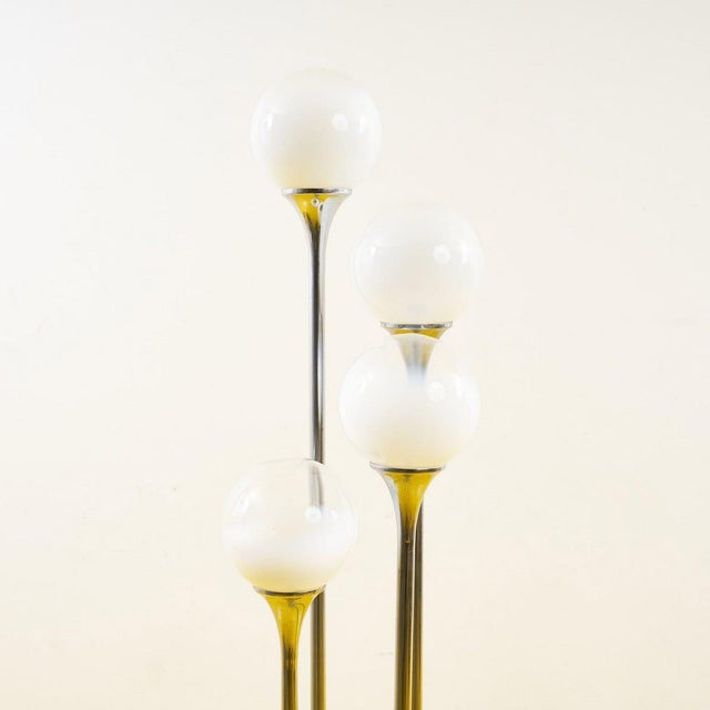 Discover this fantastic mid-century floor lamp, featuring an elegant and contemporary design. With its four white glass...