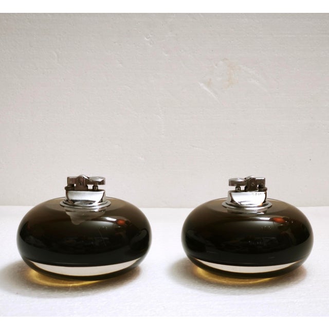A rare pair of authentic italian space age gas table lighters designed by ingo knuth and manufactured by soldi & scati,...