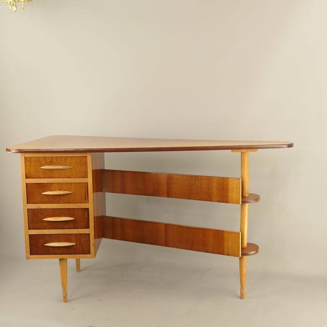 Freestanding desk from the 1960s with drawers and open shelf compartments. The desk is in good, original condition...