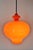 Pendant lamp by designer Hans Agne Jacobsson for Staff/AB Markaryd Glass. This pendant lamp is made of orange cased glass...