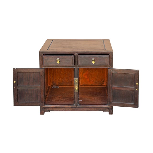 This elegant Ming-style accent cabinet is crafted from wood with a rich, dark espresso finish that beautifully showcases...