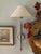 Designed by J. Randall Powers for Visual Comfort, the Hargett polished nickel wall sconce pairs a slender candlestick-...