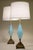 A pair of sculpturally sensual hand blown controlled thick Aqua Swirl Art Glass and ornate patine'd Brass table lamps...
