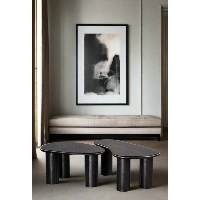 Add a unique twist to your living room with the Fendy Set of 2 Free Form Coffee Table Set. The architectural base and...