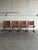 This set of four dining chairs features a minimal sling frame structure. Mid-Century Modern 1970s. Crafted with thick...