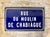 This original enamel on metal French street sign translates to Chabiage Mill Street. With the original hardware still...