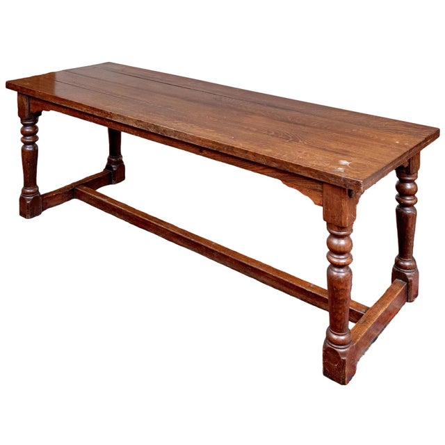 This grand antique late Victorian farmhouse table carries over a century of history. Its design is remarkably suited for...