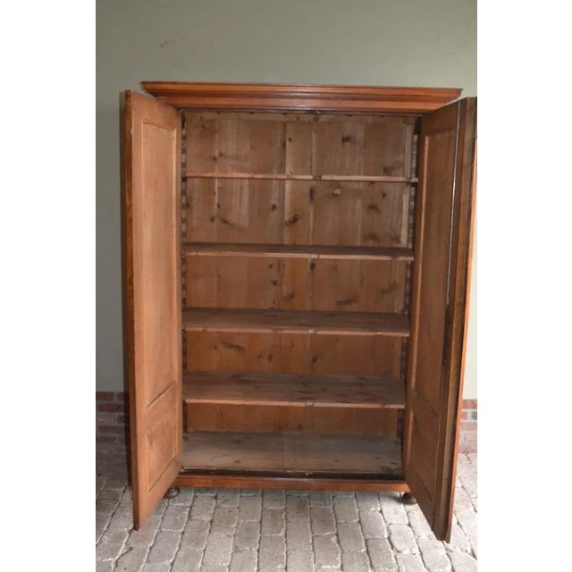 19th century German walnut cupboard. The sizes are 181x127x60. Behind the two doors height -adjustable boards. from about...