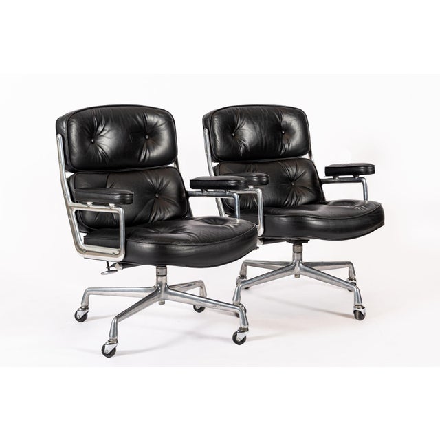 These vintage mid century modern black Model 3475 Eames Time Life Lobby Chairs designed by Charles & Ray Eames for Herman...