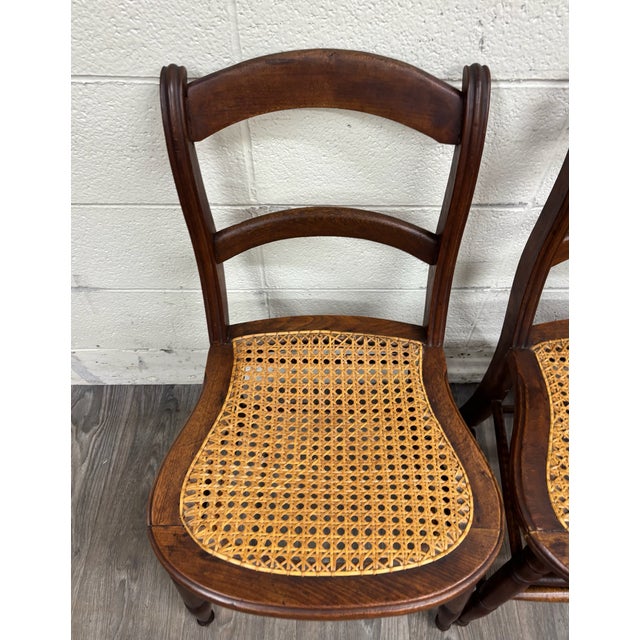 This is a stunning set of three vintage, possibly antique, Victorian Eastlake style Ladder Back cane seat dining chairs or...