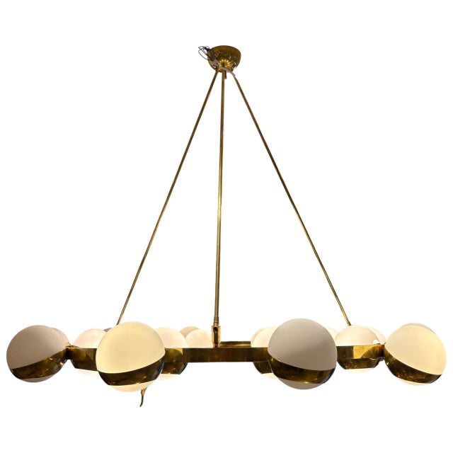This stunning Italian lamp by Stilnovo embodies the high design of 1970s Europe with its distinctive large, gilded brass...