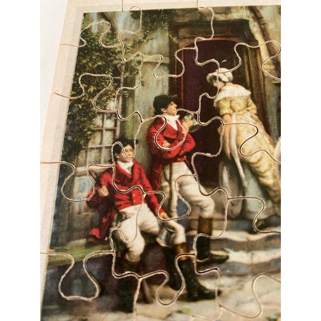 This charming vintage jigsaw puzzle features a richly illustrated English fox hunting scene, complete with red-jacketed...