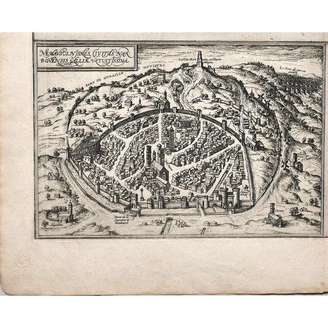 This map of nemavsus is an original etching realized by george braun (1541 – 1622) the state of preservation of the...
