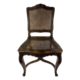 Antique Louis XV Style Carved Walnut Caned Side Chair With Floral Crest For Sale