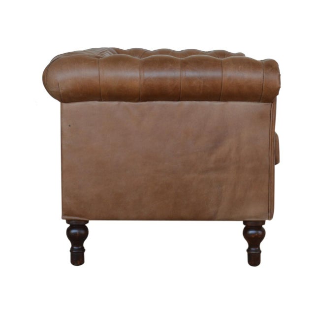 Upholstered in genuine buffalo hide, this two-seater brings classic comfort and timeless design to any room. The solid...