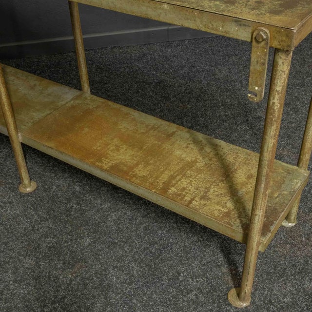 A fantastic iron/steel greenhouse table with undershelf. All the surfaces have traces of rust and the original grey/blue...