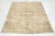 This vintage hand-knotted wool rug features a beige field with brown accents throughout the design. This rug measures...