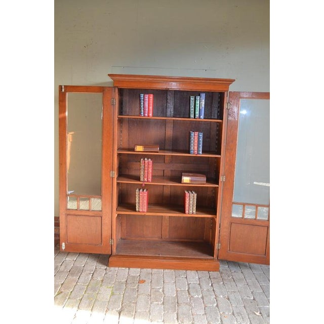 Description: 20th-century Dutch oak display cabinet, shop cabinet, china cabinet, bookcase, or library cabinet. Height:...