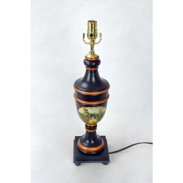 This vintage trophy cup lamp is handpainted in black with gold accents. Depictions of workers tending to the grounds...