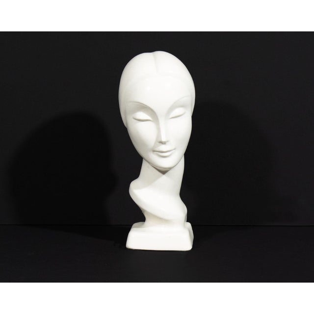 An Art Deco ceramic bust produced by AMACO (American Art Clay Company) of Indianapolis. This bust depicts an elegant woman...