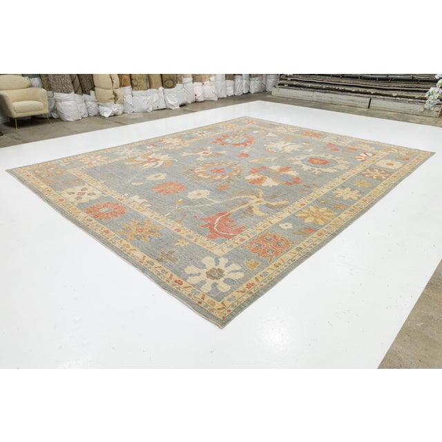Elevate your space with this Modern Oushak Style Wool Rug, featuring a slate blue field and oversized palmettes. Hand-...
