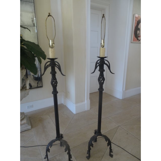 A fabulous pair of hand Wrot Iron Floor Lamps in an Italian Mediterranean Style. They were sourced from an Italian Style...