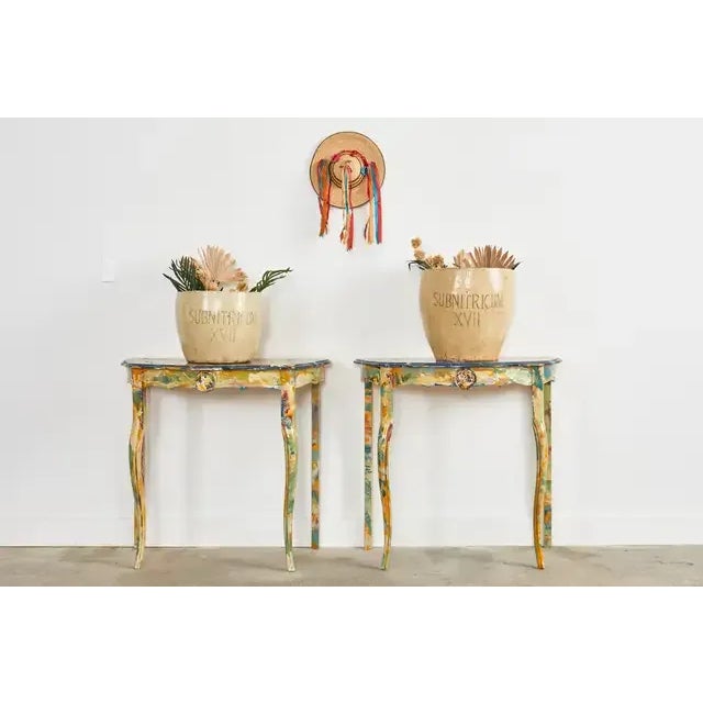 Fantastic pair of pine demi-lune console tables that form a dramatic center table painted by artist Ira Yeager (American...