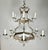 Monumental size 12-light, two-tiered silvered chandelier. The chandelier is adorned with a crown on top and cherub faces...