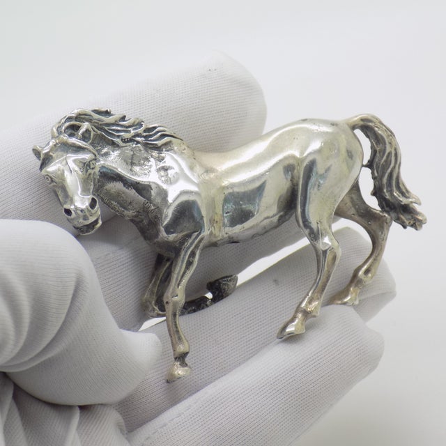 Full of spirited energy and majestic elegance, this large vintage Italian silver figurine depicts a stallion captured in...