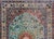 A beautiful vintage Chinese silk rug with a large central floral medallion amidst a field of large-scale flowers all woven...