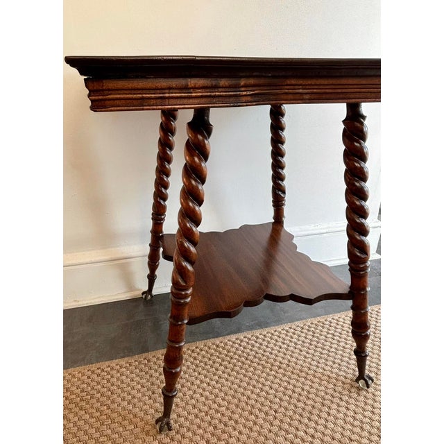 Antique American Classical side or occasional table with turned barely twist legs and glass ball feet. Features a deep...