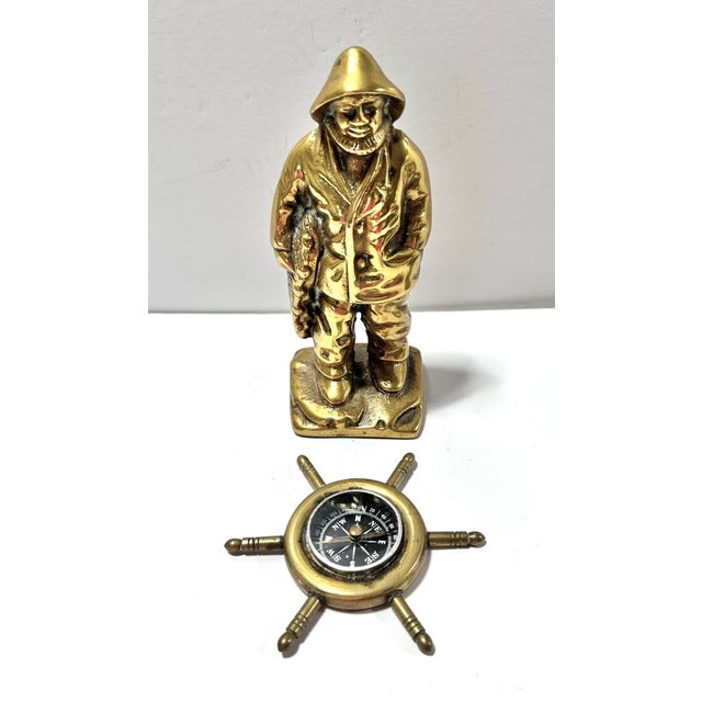 A wonderful, complimentary set of brass nautical home accents. Perfect for the cabin or beach house. The captain/seaman is...