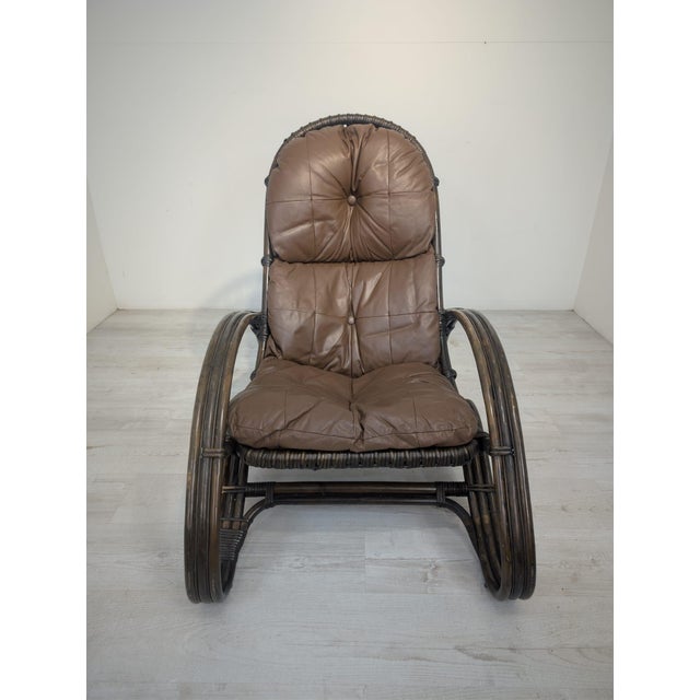 Italian rattan armchair, natural leather, 1960s design This unique Italian lounge armchair from the 1960s combines the...