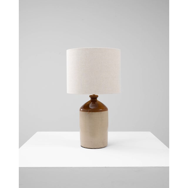 This 20th Century English ceramic jug table lamp draws its character from the charm of traditional utilitarian pottery....