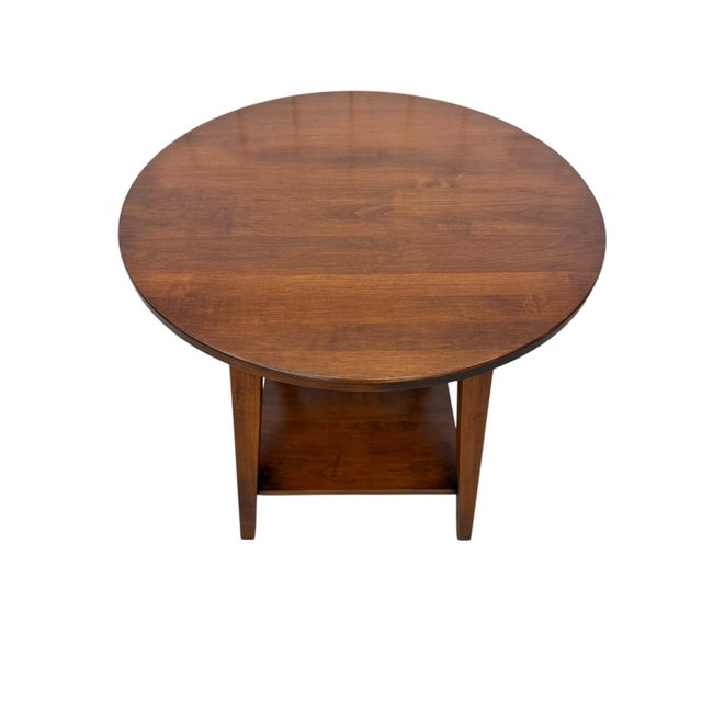 Bring timeless American craftsmanship into your home with this charming Ethan Allen Country Colors round side table....