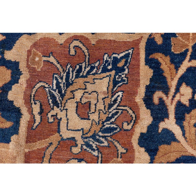 Made in the city of Kerman, famous for exquisite weaving art, this antique carpet is a elegance incarnate. Handmade by a...