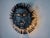 Superb and rare face wall lamp in the shape of a sun made in Spain in the 1970s. Large brutalist design which is greatly...