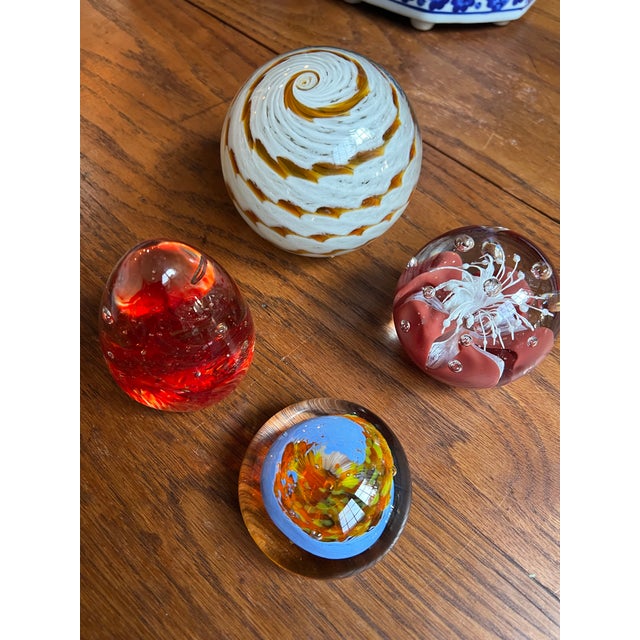 Up for consideration is a beautiful vintage collection of orange and red glass paperweights. These would look lovely in...