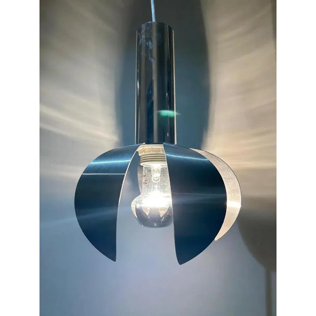 Chrome and reflector suspension in brushed steel blades Diameter reflector 20cm Height with chrome part 28cm Adjustable...