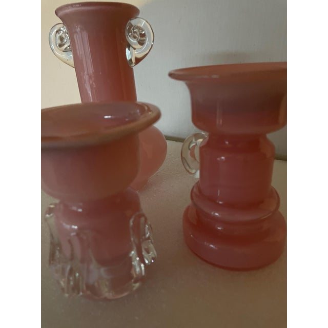 The 18cm high dimension refers to the largest of the 3 vases; one is 13cm high and the other is 11cm high.