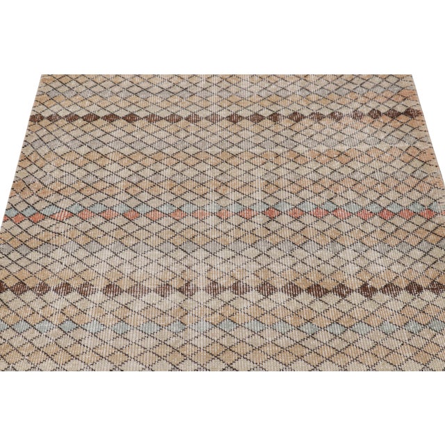 Hand-knotted in wool and originating from Turkey circa 1960 – 1970, this 3x7 vintage Zeki Müren rug is a unique addition...