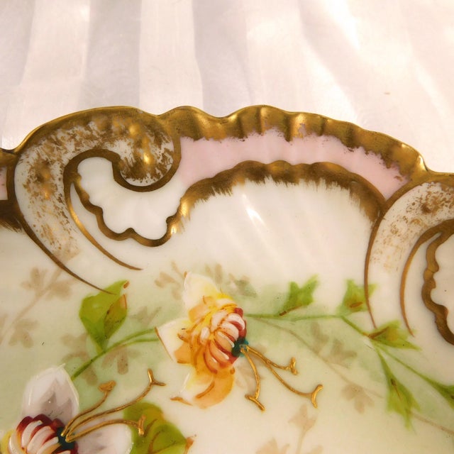 This is an Alfred Klingenberg Charles Dwenger Limoges plate or bowl that was made between 1900 and 1909. The bowl is...