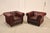 High Quality Pair of Tufted Red Leather Lounge Chairs with Brass Tack Trim, Mounted on Turned Feet