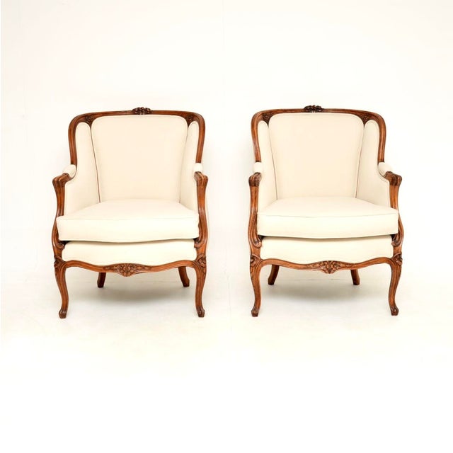 A stunning pair of antique French walnut armchairs. They were made in France and date from around the 1920’s. The quality...