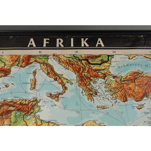 A striking relic of post-war European pedagogy, this vintage school wall map of Africa was produced in Germany during the...