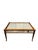 Bring timeless character to your home with this vintage mirrored coffee table. Featuring a rich wood frame, beveled glass...