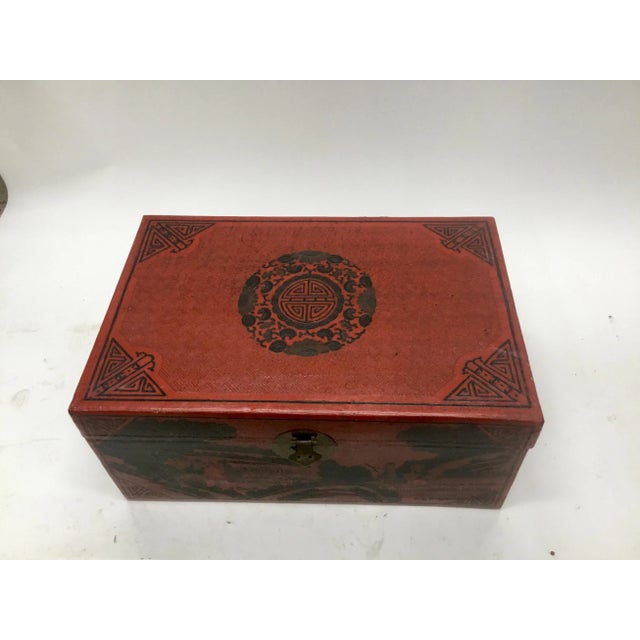 Chinese red leather with hand tooled and painted traditional Chinese decorations. Solid brass hand etched hardware. Dark...